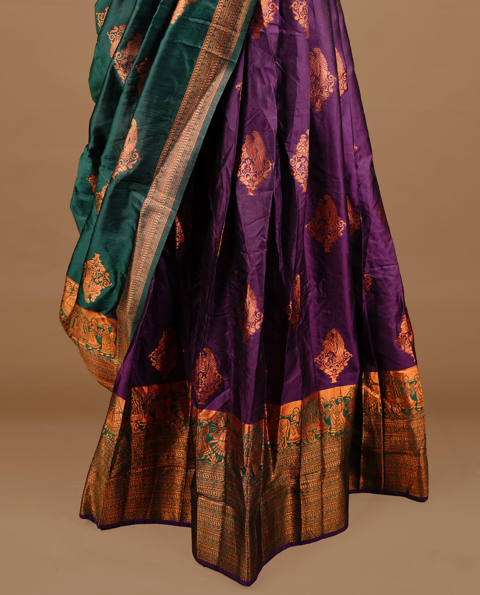 Green colour Half saree featuring Purple colour skirt with contrast green colour traditional border, paired with matching stitched blouse, contrast green dupatta.