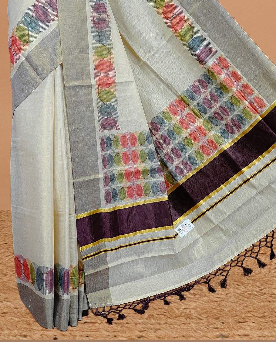 Cream Colour Tissue Kerala Saree Featuring Multicolour Circular Prints Along The Border And Pallu, Complemented By A Brown Border With Traditional Gold Zari Accents, Paired With A Matching Blouse Piece.