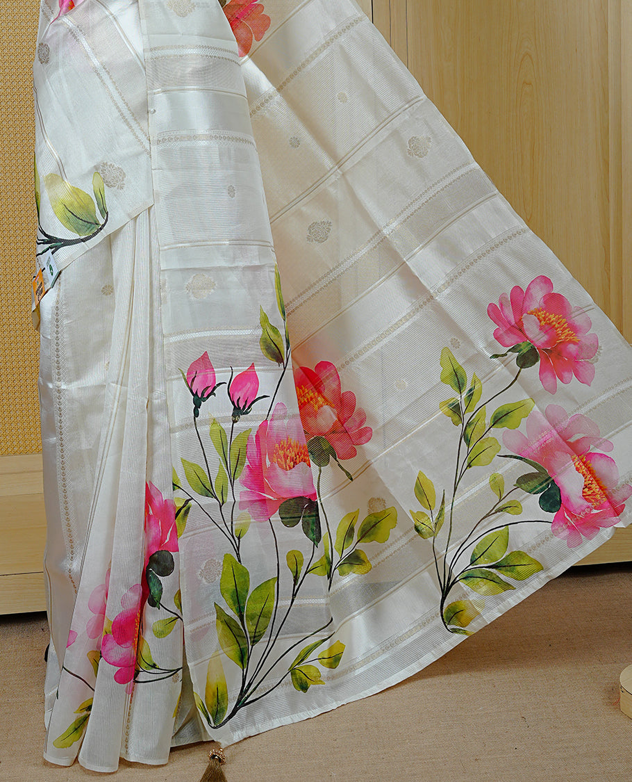 Cream Colour Organza Kerala Saree Featuring Floral Printed Motifs On The Body & Tassels On The Pallu, Paired With A Matching Blouse Piece.