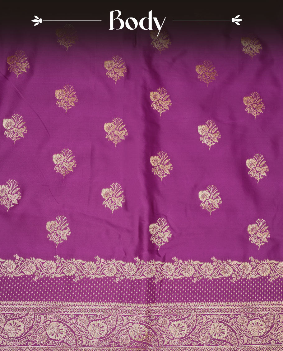 Grape purple colour Banaras Satin Crepe saree featuring gold zari floral motifs on the body, a richly woven traditional border with intricate gold zari detailing, and paired with a matching blouse. (Copy)
