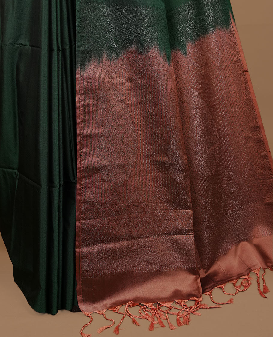 Green colour soft silk saree features a sleek borderless design with intricate antique zari motifs, flowing into a striking contrast Biscuit orange pallu and a matching blouse piece.