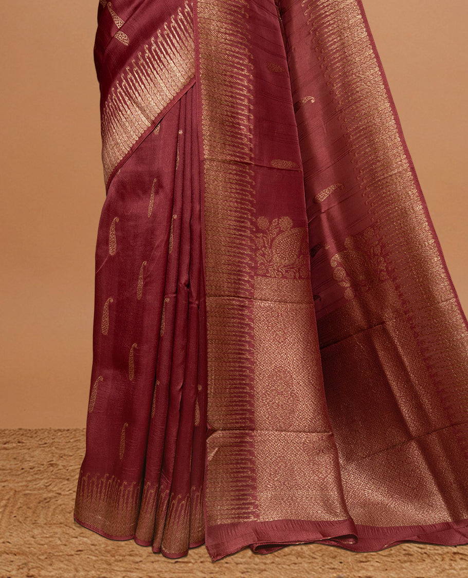Burnt Umber colour Semi Banaras Tussar Georgette Featuring Gold zari Leaf pattern on body, Finished with Gold zari border and paired with matching blouse piece.