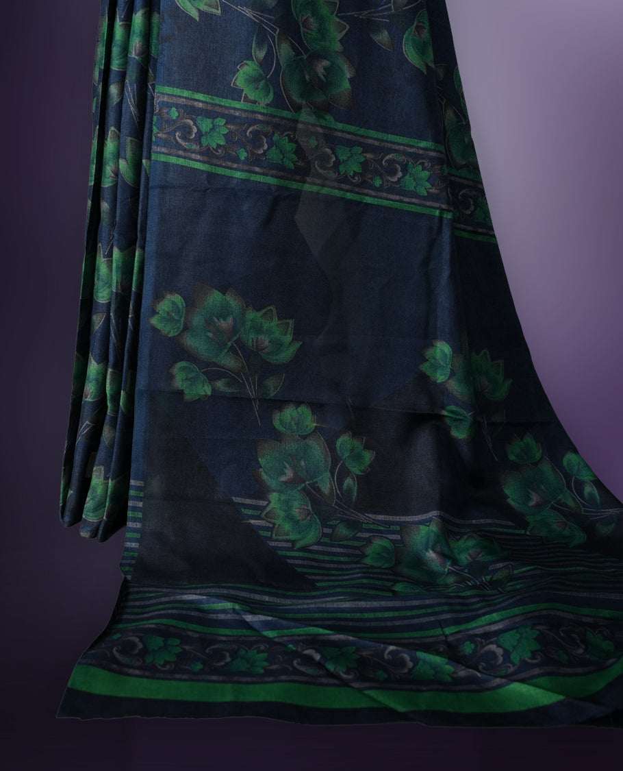 Navy Blue colour saree enhanced with a vibrant green colour floral prints on body & pallu, and comes with a matching blouse.