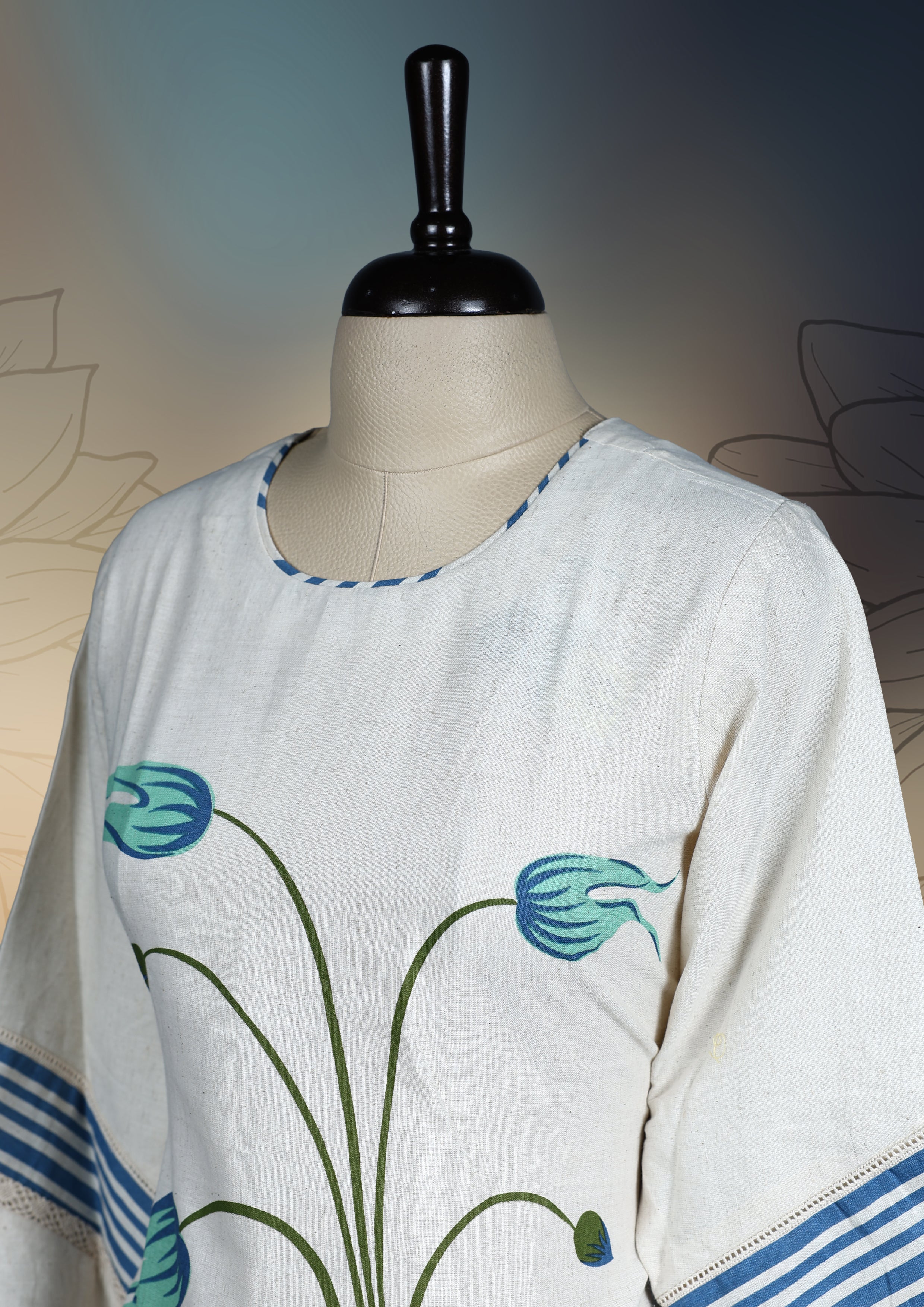 Off white colour kurthi with elegant pastel blue floral prints and leafy patterns on the front, accented by striped detailing on the sleeves, Perfect for a stylish yet comfortable casual or semi-formal look.