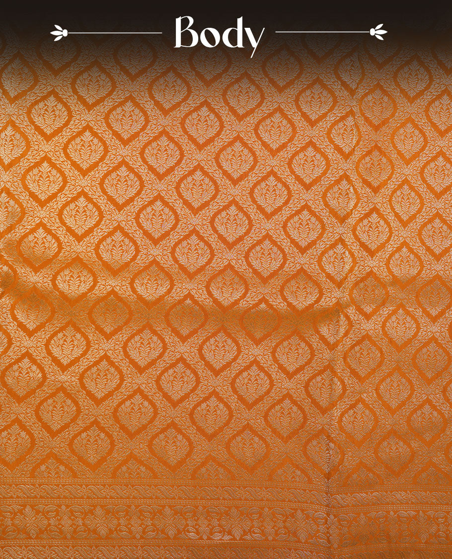 Orange colour banaras satin crepe saree featuring gold zari pattern across body, with self colour border with gold zari pattern and paired with matching blouse.