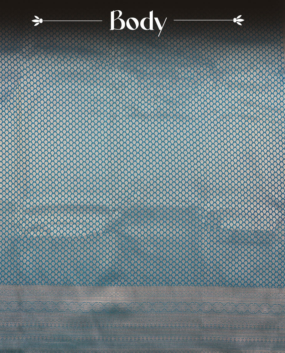 Teal colour semi silk brocade saree featuring intricate Gold patterns across the body, complemented by a Self colour woven border and pallu, paired with a matching blouse.