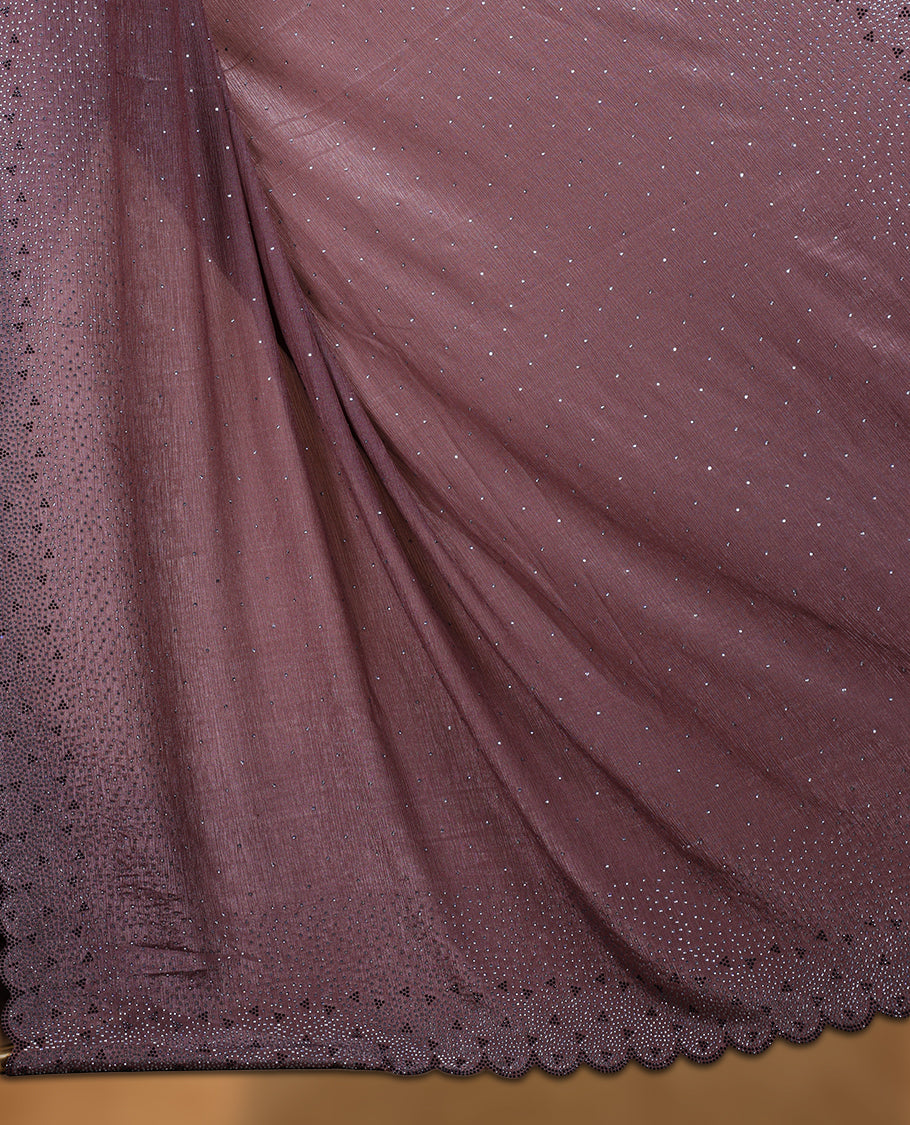 Brown colour chiffon designer saree, featuring black and white scattered stone on body, stone work and heavy stone leaf pattern on border and pallu, Paired with matching blouse.