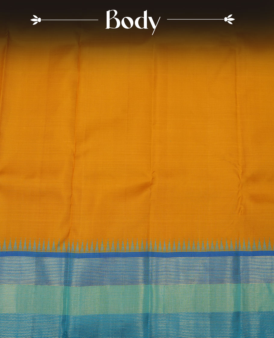 Mustard yellow colour pure traditional Kancheepuram silk saree featuring elegant contrast borders in shades of blue and green with classic zari detailing, beautifully paired with a matching blouse piece