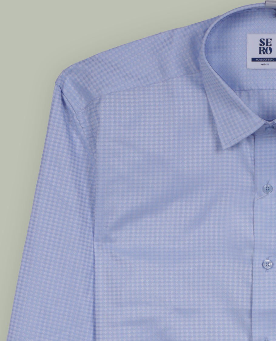 Soft blue colour full sleeve shirt featuring an all over abstract geometric print for a modern, stylish appeal, Designed with a classic collar and button down front, perfect for smart casual outings.