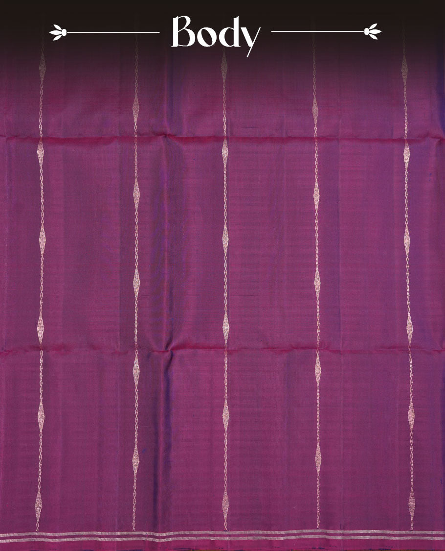 Purple colour soft silk saree featuring gold zari motifs on body, complemented by self colour with traditional border with tassel at pallu, paired with matching blouse piece.