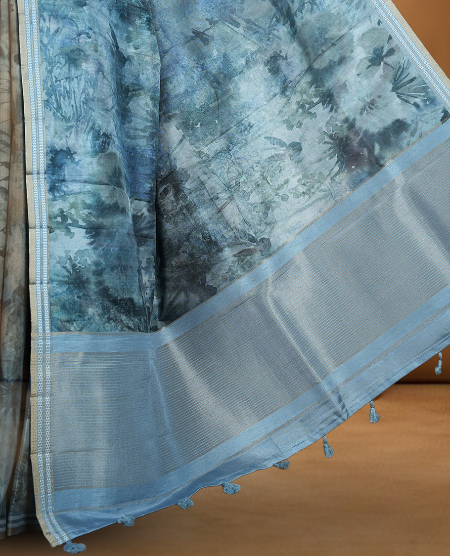 Dark Green colour semi tussar silk saree featuring an abstract floral printed body with a rich self border and tasselled pallu, paired with a matching blouse.