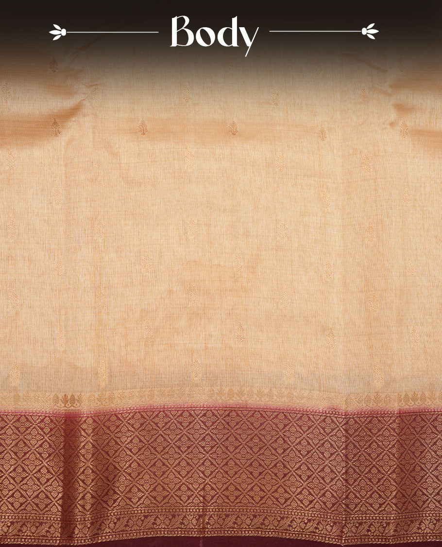 Light gold colour semi tussar saree featuring Gold zari buttas body, contrast chocolate brown colour gold zari border and comes with matching blouse piece.