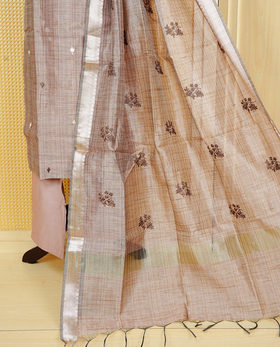 Brown colour Tissue Churidar Set featuring delicate floral embroidery and subtle sequin detailing on the yoke, paired with matching solid pants and dupatta.