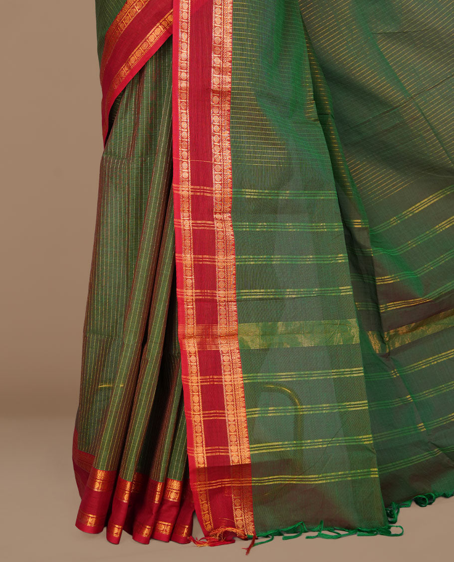 Green colour chettinad cotton featuring gold zari check pattern on body , complemented by contrast Maroon colour with gold zari border, paired with matching blouse piece.