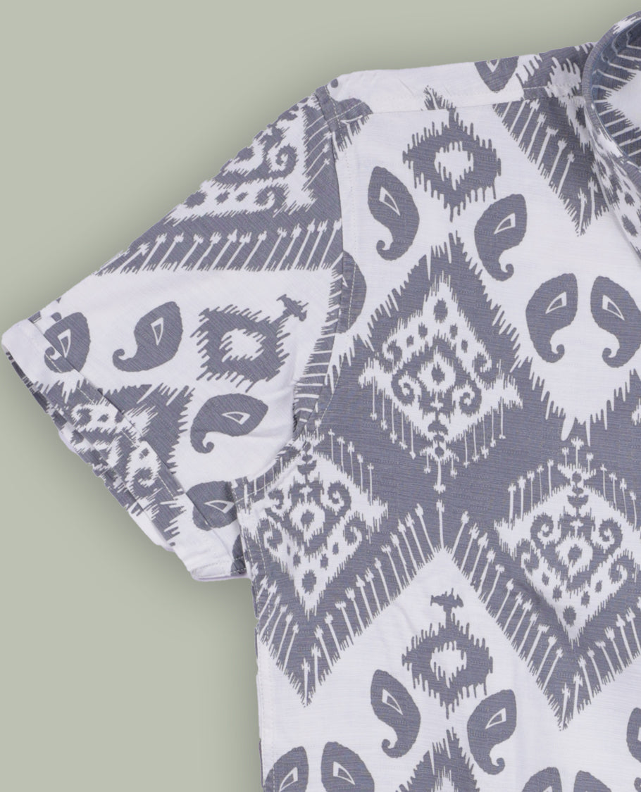 Off white colour shirt featuring stylish grey prints all over, Designed with a classic shirt collar and short sleeves, this shirt offers a modern yet casual appeal.