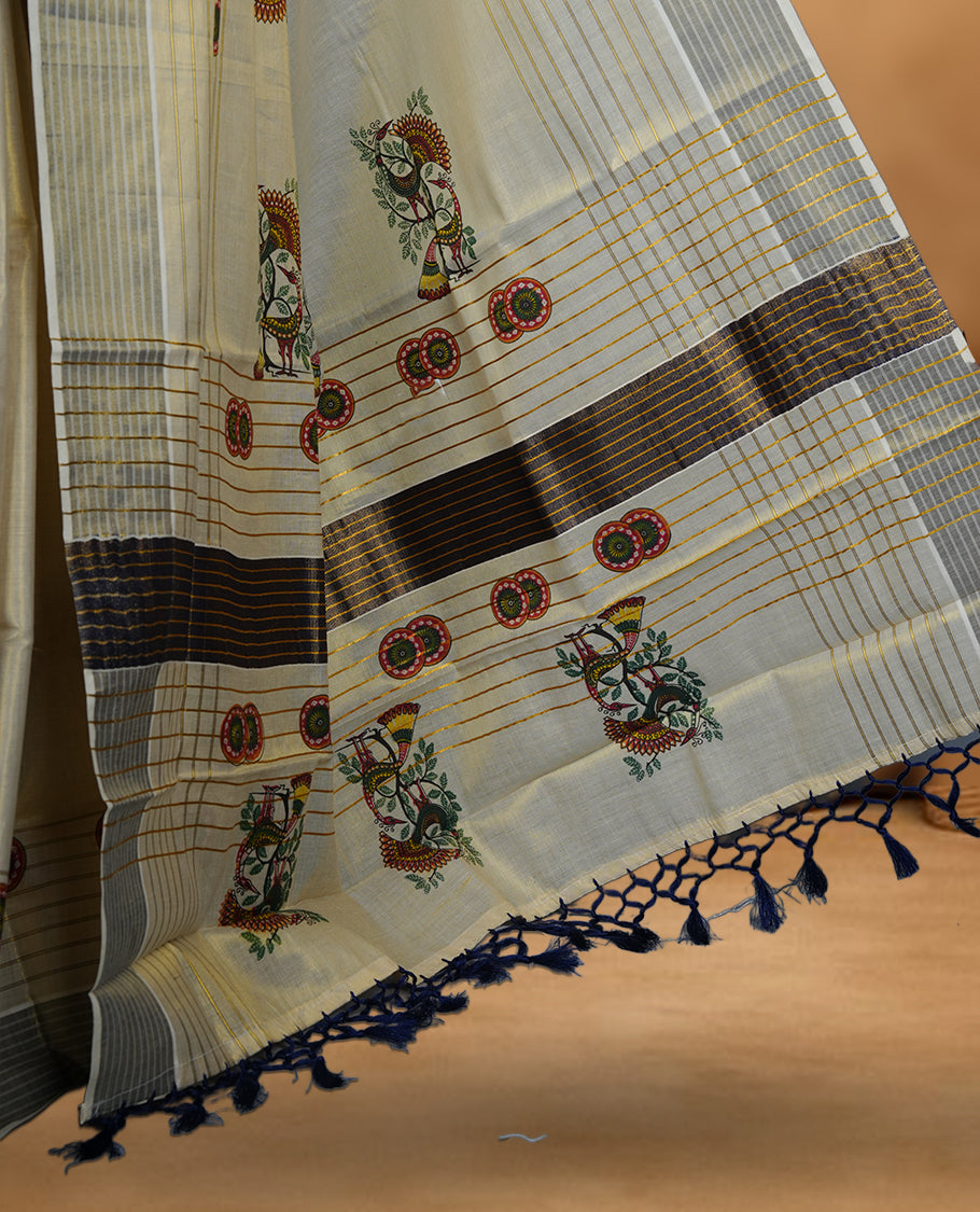 Light gold colour Tissue Kerala saree featuring a Plain body, an intricately woven gold and blue traditional pallu and border with chakra and peacok pattern paired with a matching blouse.