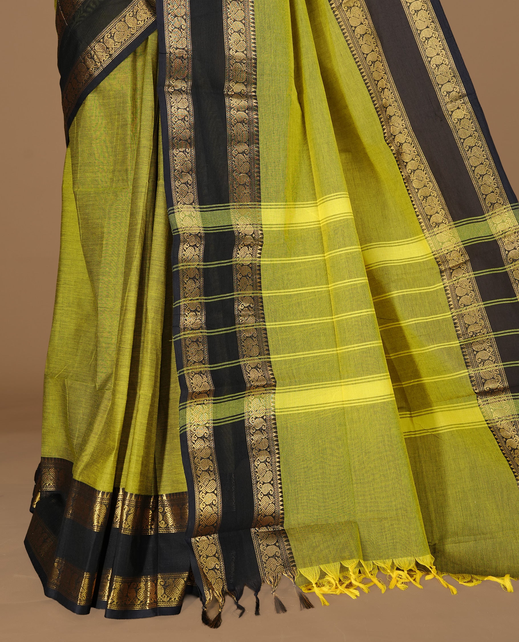 Olive Colour chettinad cotton saree featuring Elegant plain body, complemented by contrast Dark blue colour with gold zari border, paired with matching blouse.