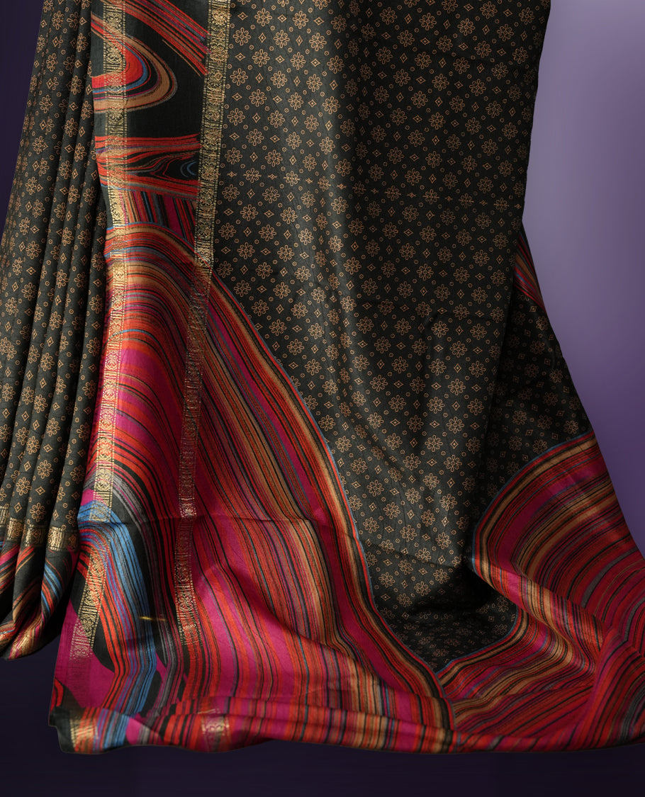 Black colour saree enhanced with a vibrant golden border and multiple colour prints pallu, adorned with intricate golden floral colour prints on the body & comes with a matching blouse.
