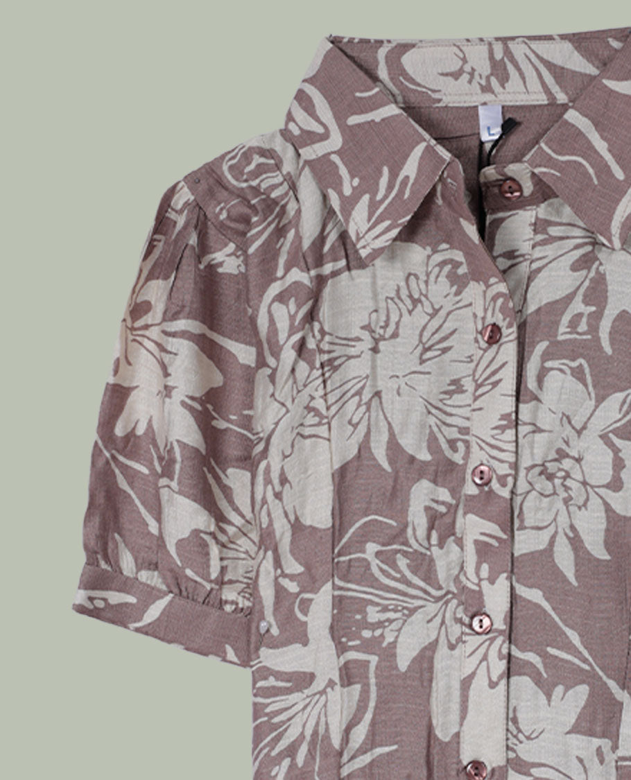 Dusty mauve floral printed shirt top with collared neckline, front button placket, short cuffed sleeves, and soft gathers at the shoulders.