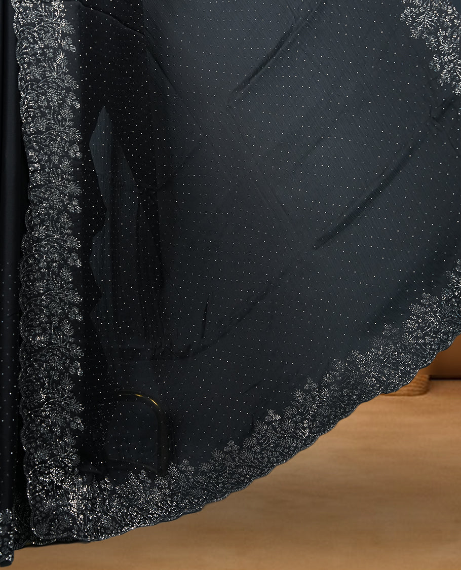 Black Colour Chiffon Designer Saree featuring Delicate White Stone Work All Over the Body, with Stone Detailing on the Border and Pallu, paired with a Matching Blouse.