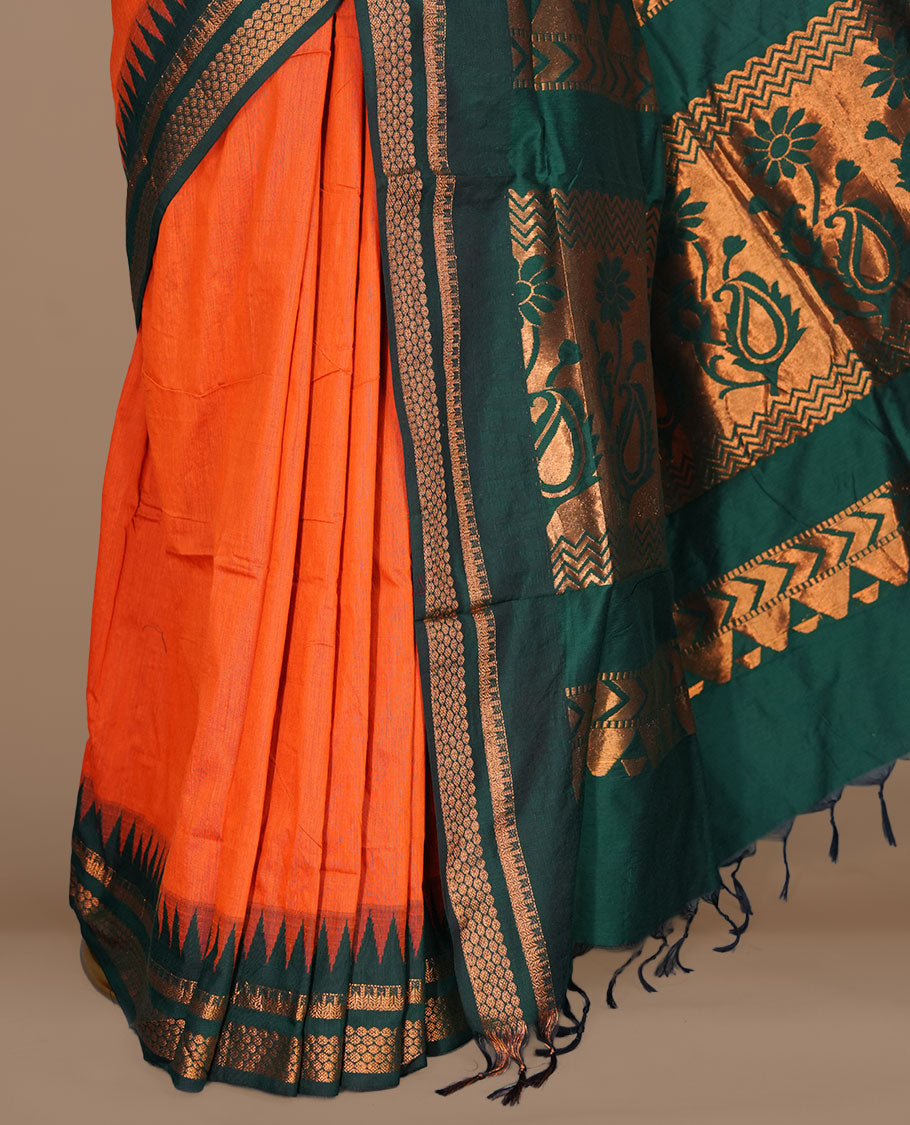 Orange colour kalyani cotton saree featuring gold zari motifs on body, complemented by contrast green color with gold zari pattern border , paired with matching blouse piece.