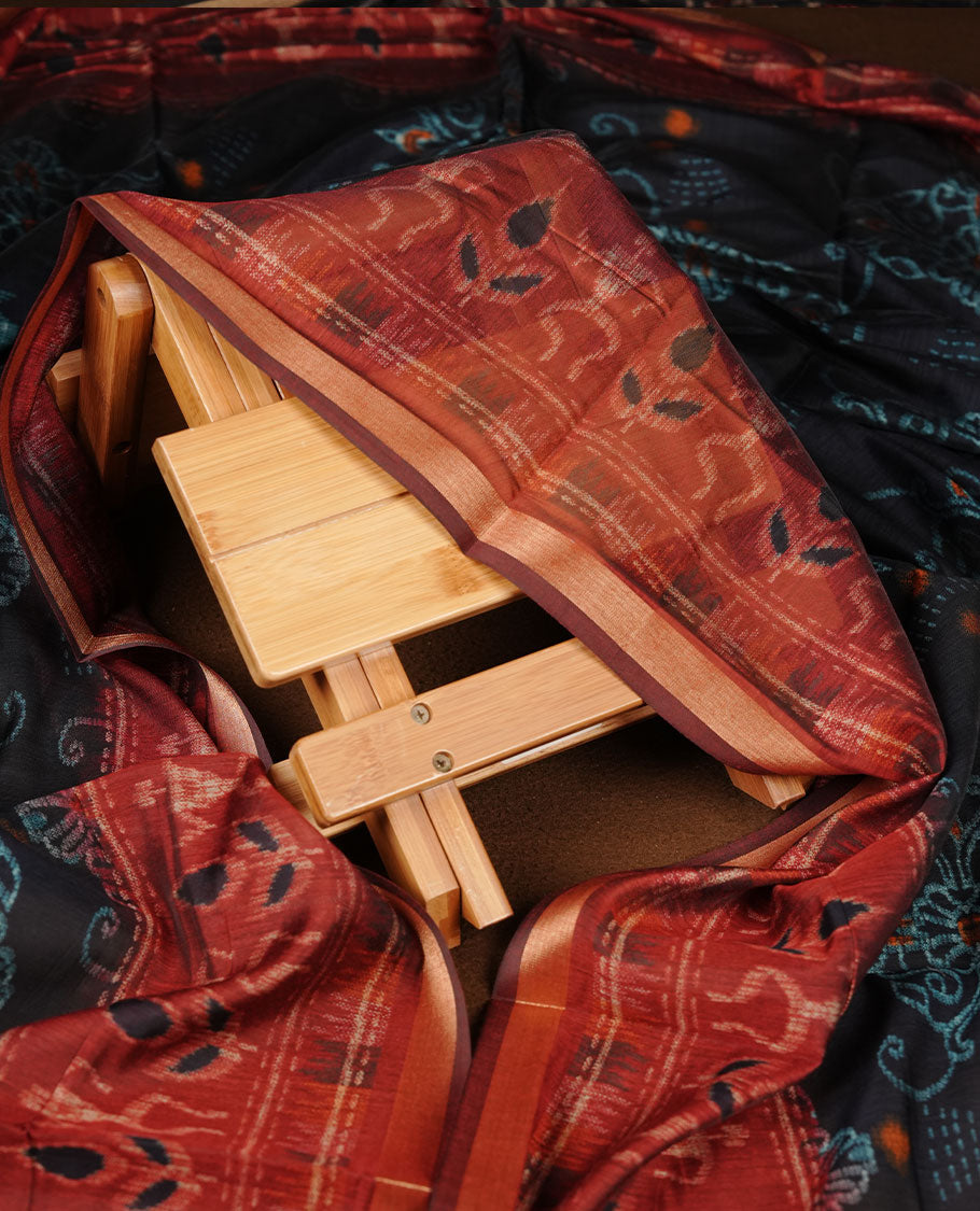 Black churidar material featuring a subtle dotted printed body, paired with an intricately printed maroon dupatta