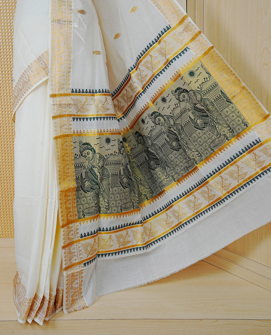 Cream Colour Cotton Kerala Saree Featuring Gold Buttas on the Body, a Classy Gold Zari Border, and a Traditional Green Colour Lord Krishna Thread work and Gold Zari Pallu, Paired with a Matching Blouse Piece.