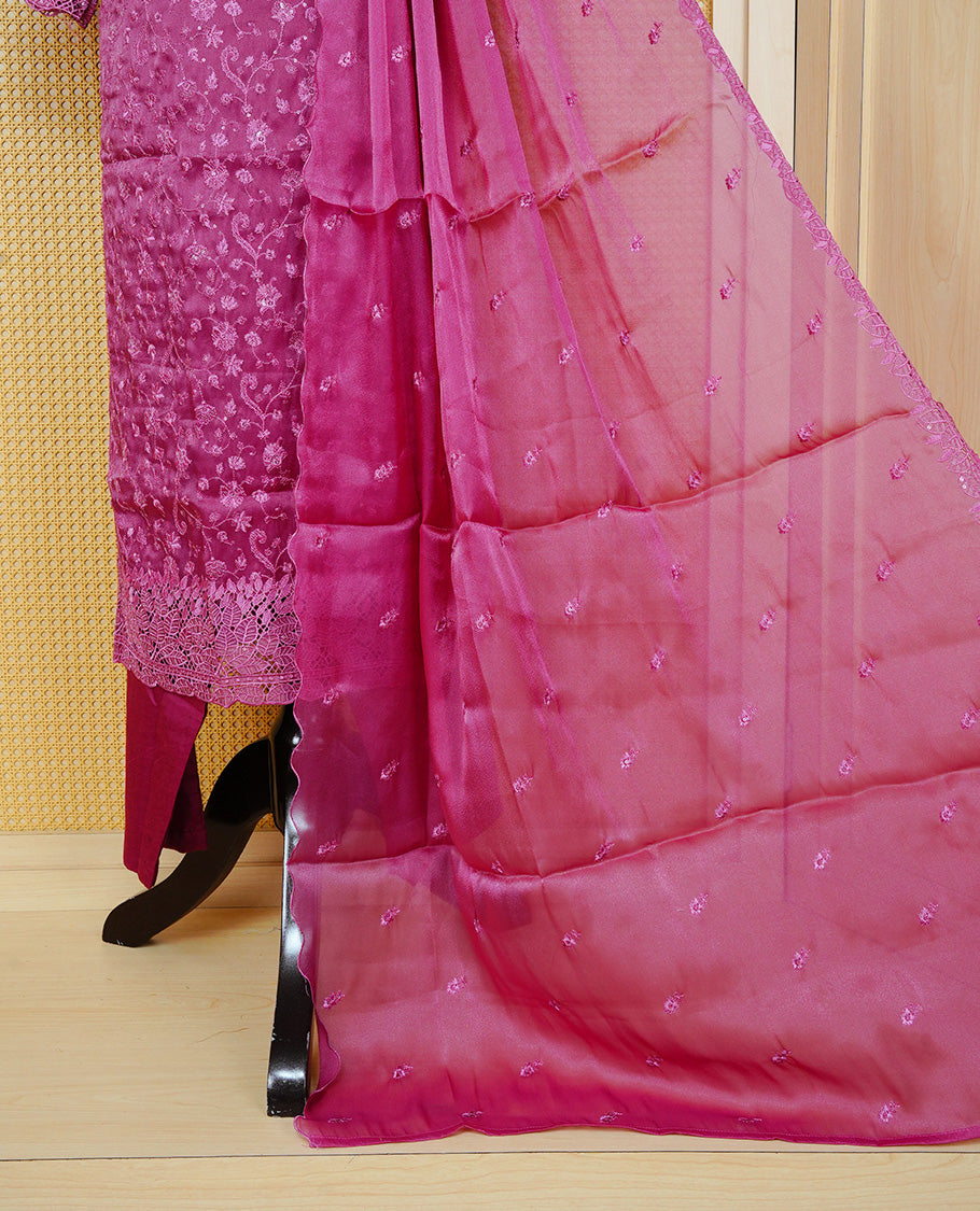Dark Dusty Pink colour churidar set featuring delicate floral embroidery on the kurta, lace-trimmed sleeves and hem, paired with matching solid pants and an embellished sheer dupatta.
