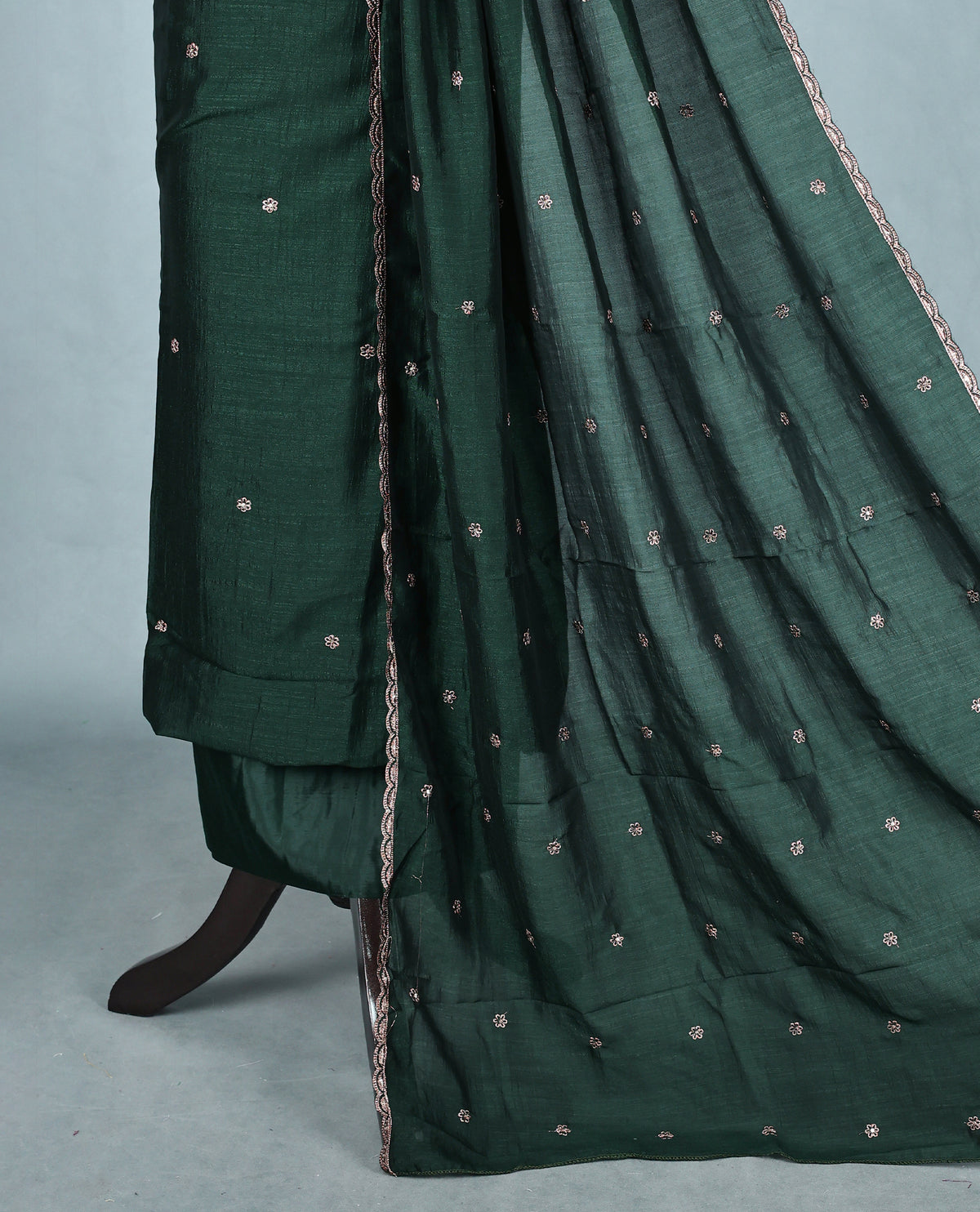 Bottle Green colour Vijitra Silk Salwar Material featuring elegant white thread embroidery on the front panel, paired with a matching bottom and a gracefully embroidered dupatta.
