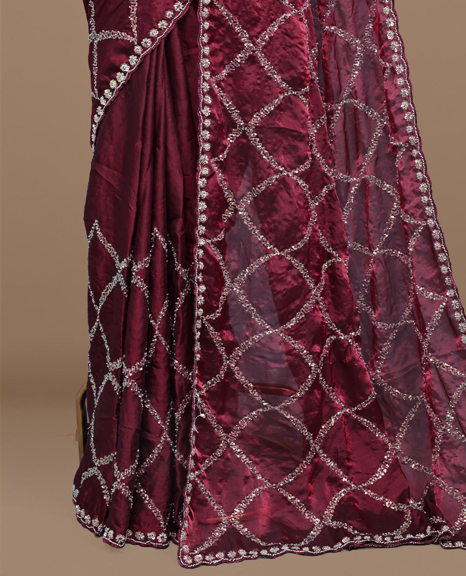 Maroon colour designer saree featuring Sequins & cut beats worked body, cut beat worked border, paired with matching unstitched blouse.