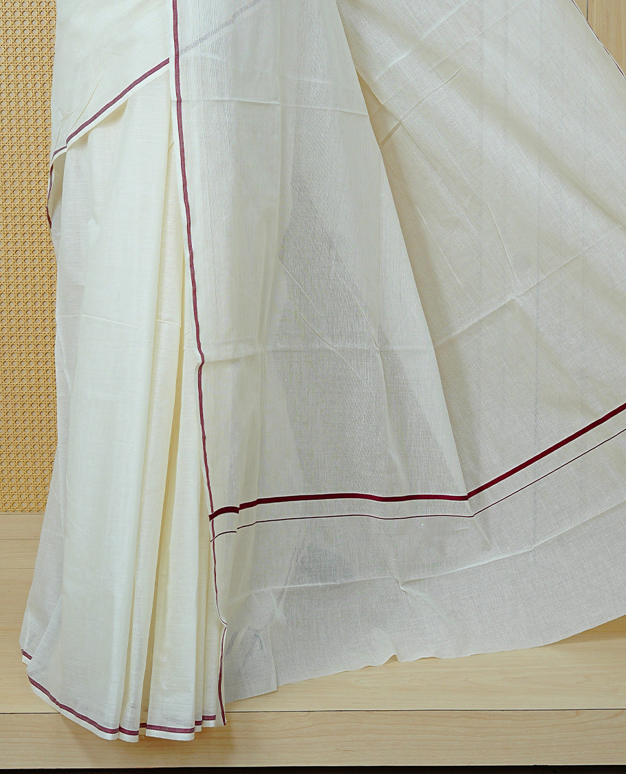 Cream Colour Cotton Kerala Saree Featuring A Classy Plain Body For Effortless Elegance, Enhanced By A Minimalist Maroon Border, Paired With A Matching Blouse Piece.