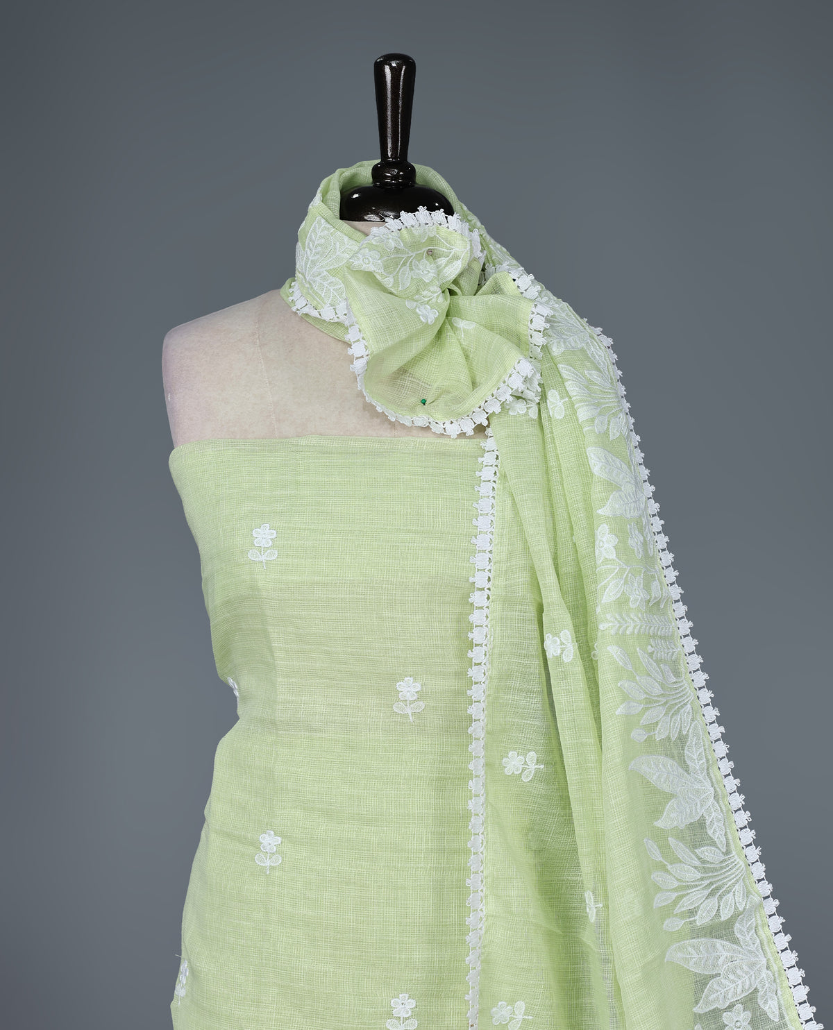 Pastel Lime Green Colour Kotta Net Salwar Material featuring delicate white floral embroidery on the kurta and dupatta, paired with a matching solid bottom for a fresh, elegant, and graceful ethnic look.