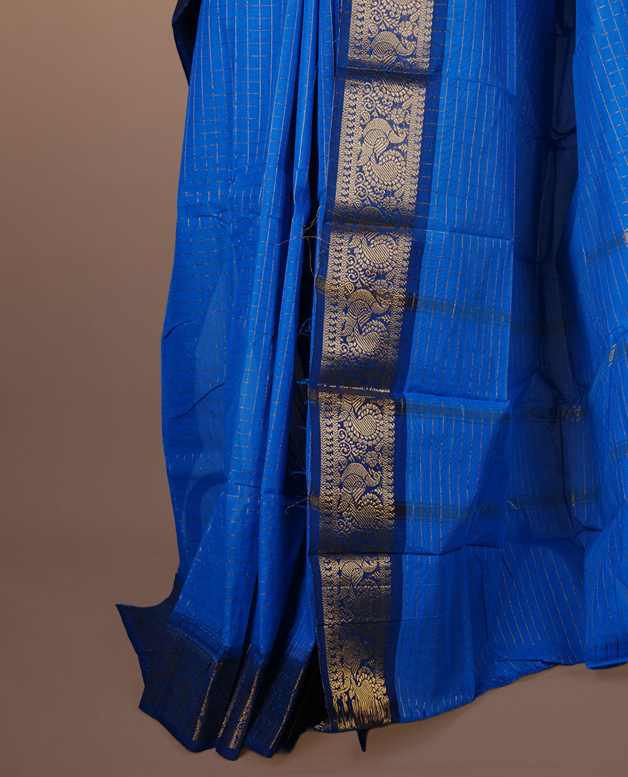 Sky blue colour sungudi cotton saree featuring gold zari check pattern across body, contrast Dark blue colour with gold zari peacock and floral pattern on border, without blouse piece.