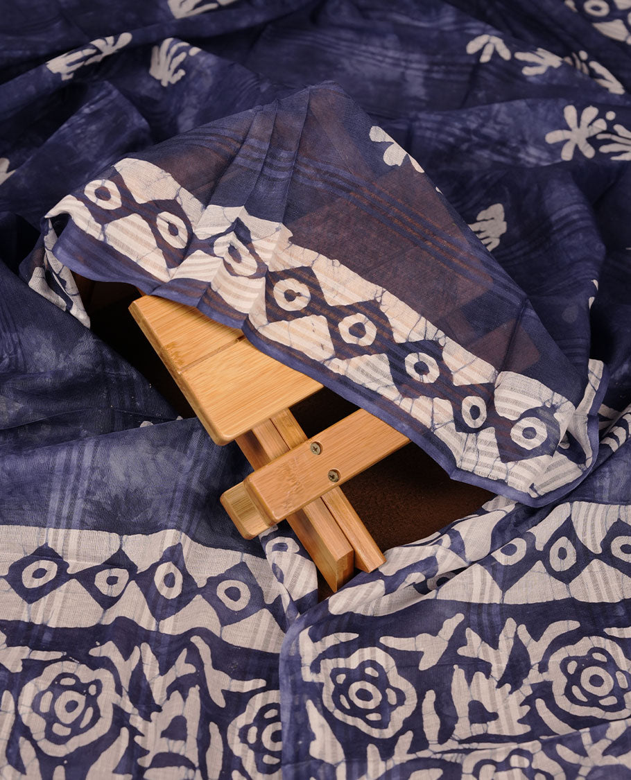 Blue colour churidar material featuring white floral printed body, paired with a matching chevron printed dupatta.