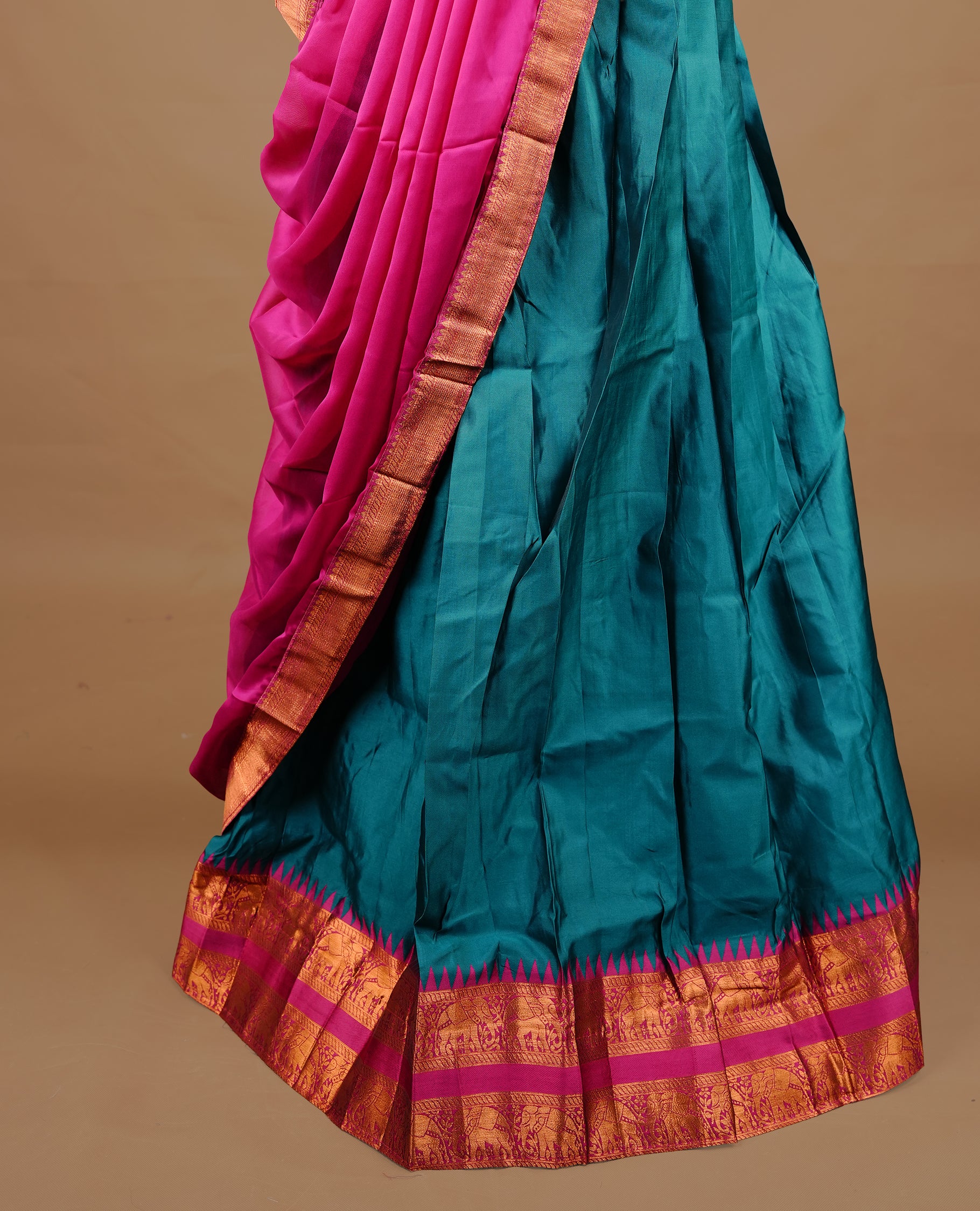 Green colour semi stitched Half saree featuring contrast Magenta colour with gold zari traditional border skirt, paired with matching zari border dupatta, unstitched blouse piece