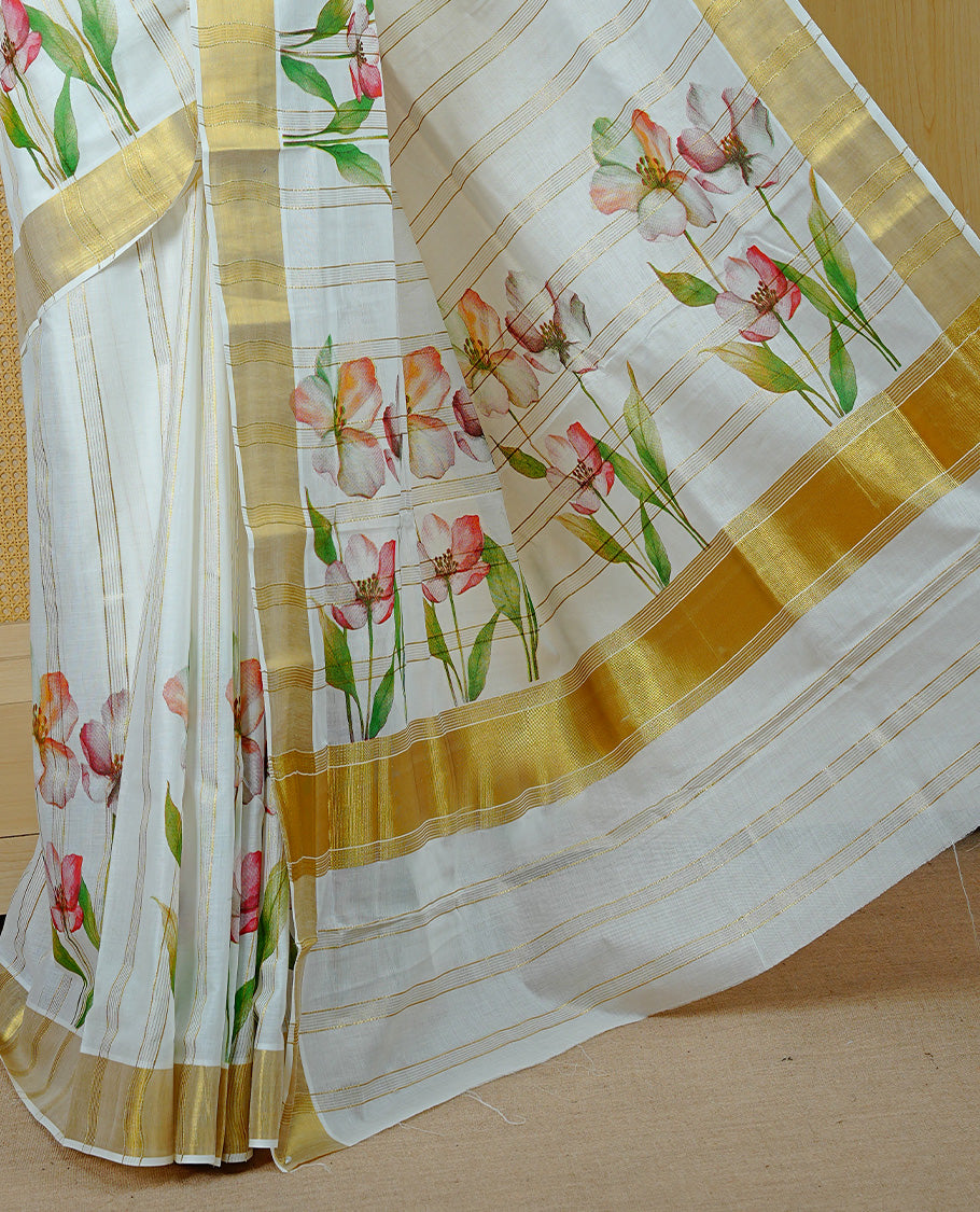 Cream Colour Kerala Saree Featuring Gold Zari Stripes On Body, Enrich Gold Zari With Floral Printed Border & Pallu, Paired With Matching Blouse Piece.