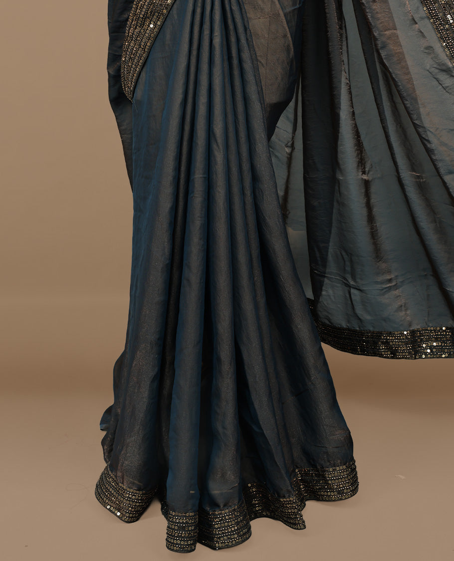 Gold & blue double shade designer saree features Elegant plain body, highlights Sequins & cut beats on border, paired with ready made blouse.