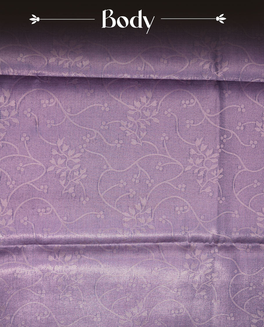 Lavender colour semi tussar silk saree, featuring an intricate gold zari floral kodi pattern on the body and pallu, comes with matching blouse.