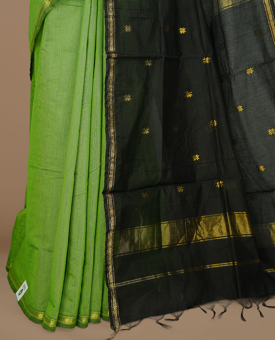 Green colour Maheshwari cotton saree features elegant gold zari motifs across the body, a classic gold zari border, a striking contrast pallu, and a matching blouse piece.