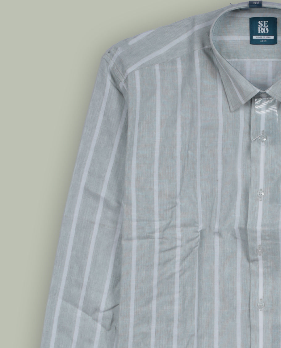 Light green colour full sleeve shirt featuring vertical white stripes for a clean, slimming look & Styled with a classic collar, button down front, and chest pocket.