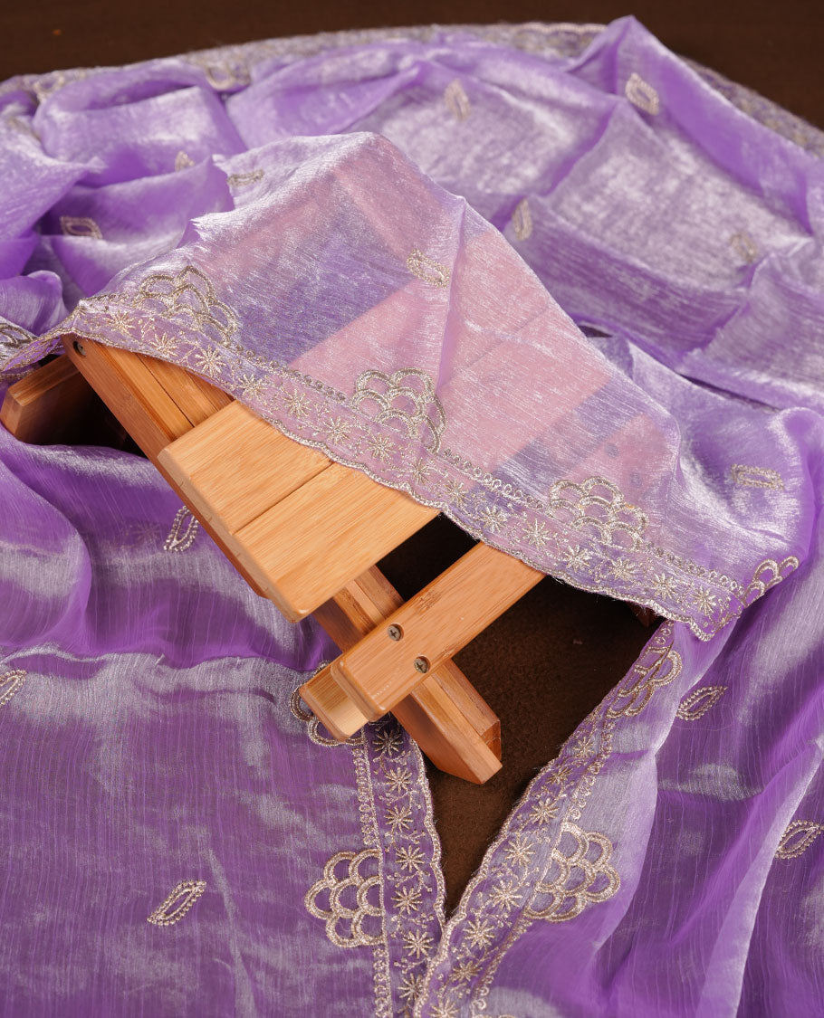 Lavender colour churidar set with stone and thread embroidery and detailing, paired with matching pant and dupatta.