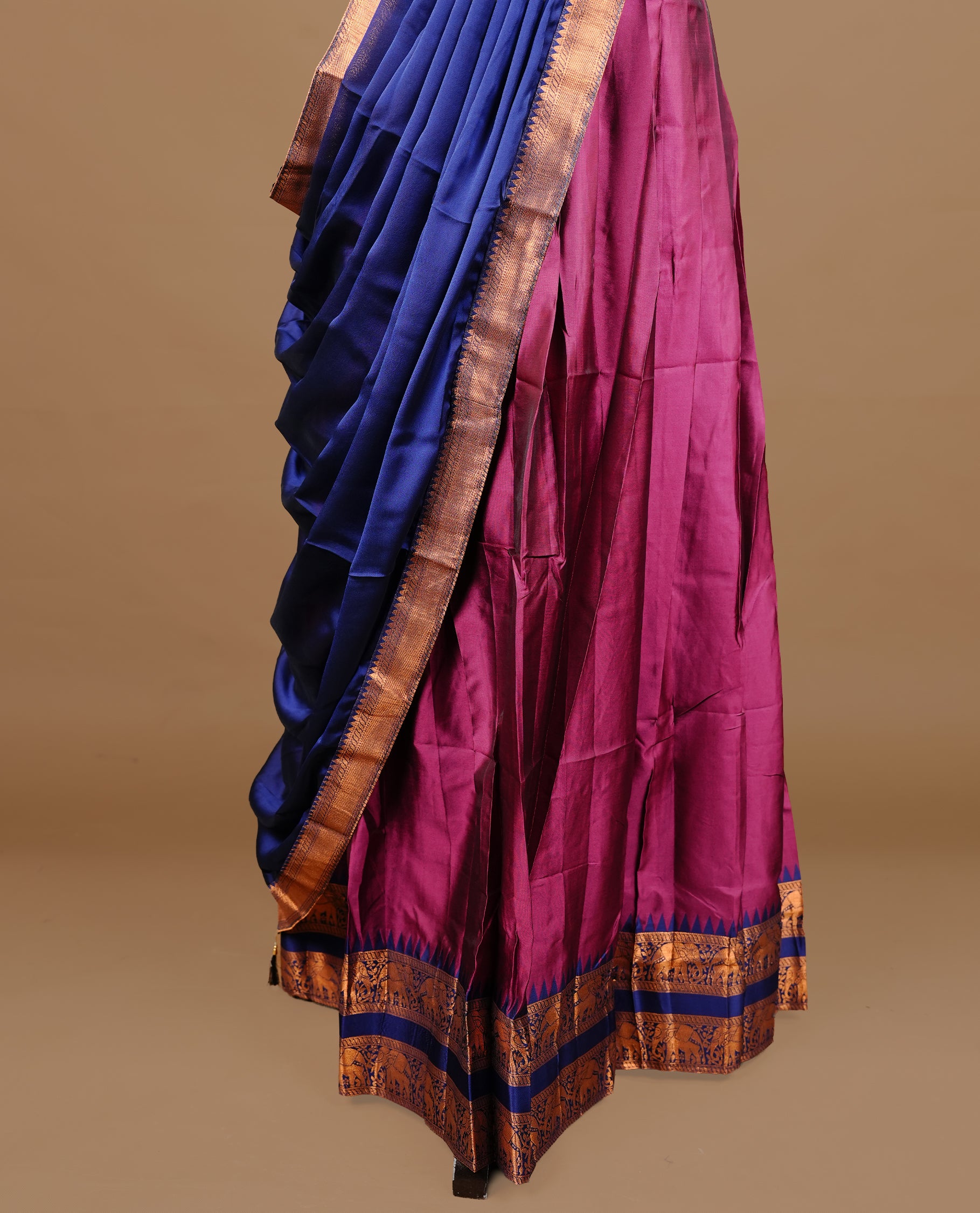 Burgundy colour semi stitched Half saree featuring contrast navy blue colour with Antique zari traditional border skirt, paired with matching zari border dupatta, unstitched blouse piece