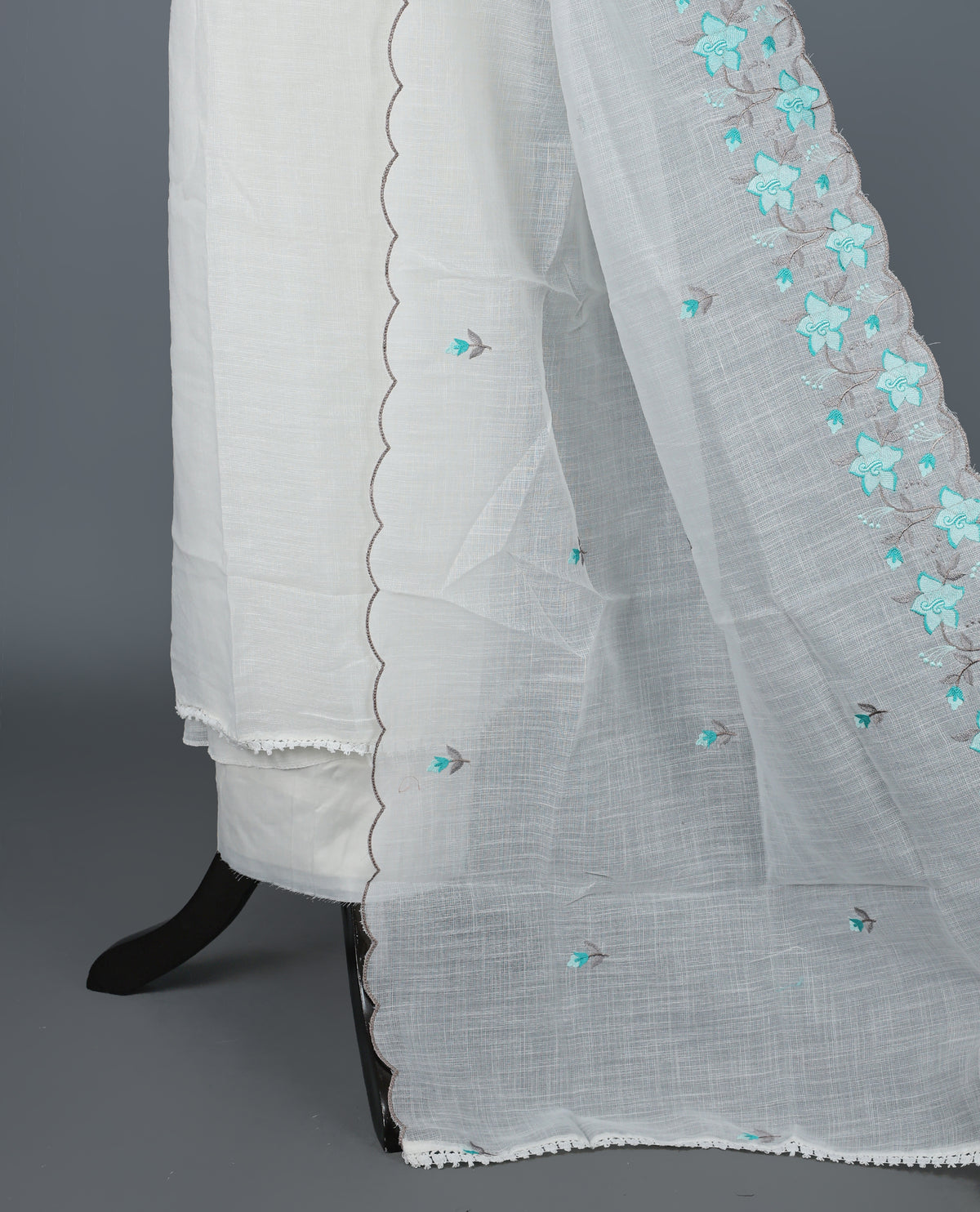 Off White Kotta Net Salwar Material featuring elegant aqua floral thread embroidery on yoke, paired with a matching bottom and an embroidered dupatta.