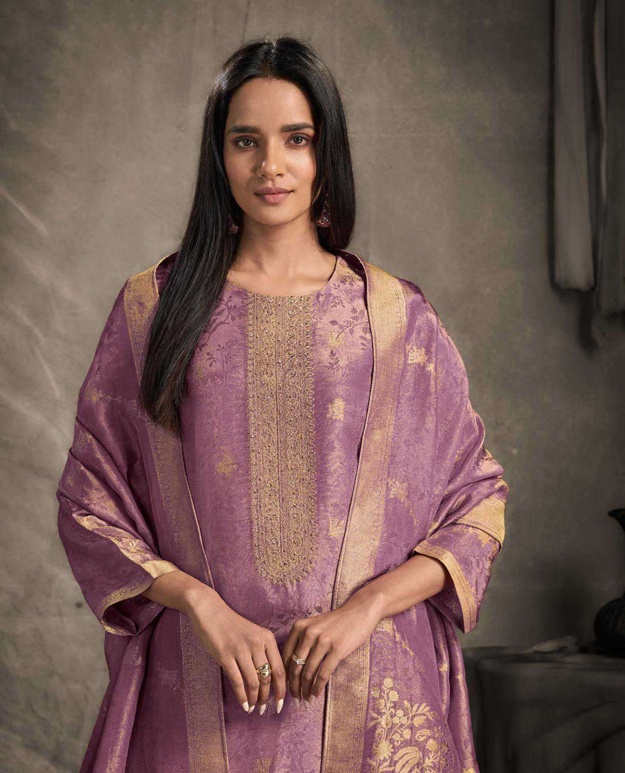 Lavender colour suit material featuring an Akina silk jacquard top with delicate embroidery, paired with satin bottoms and completed with a matching Akina silk jacquard dupatta