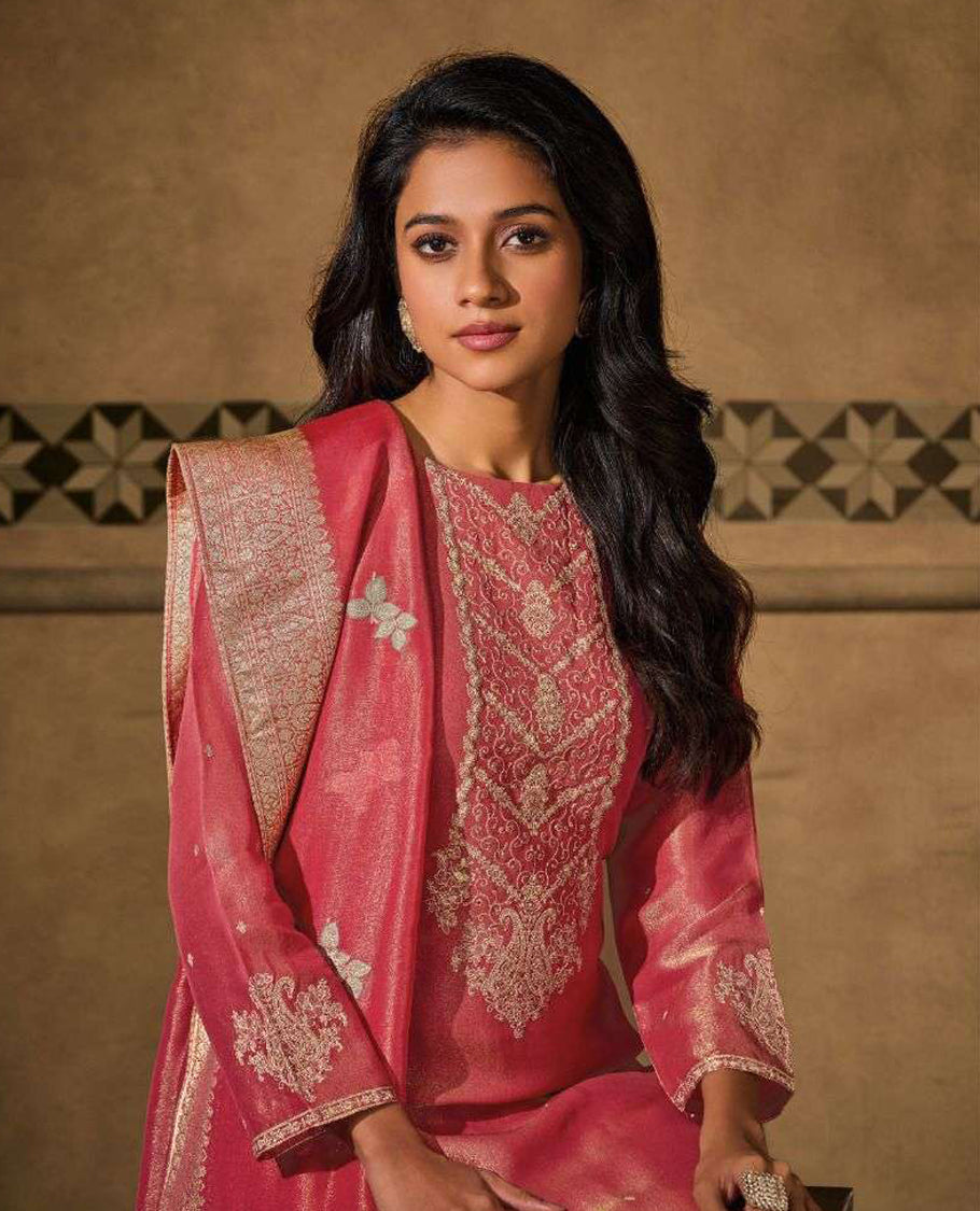Pink peach colour suit material with silk tissue embroidered top featuring elegant handwork and detailed sleeve work, paired with matching satin bottom and a contrast colour lightweight printed dupatta
