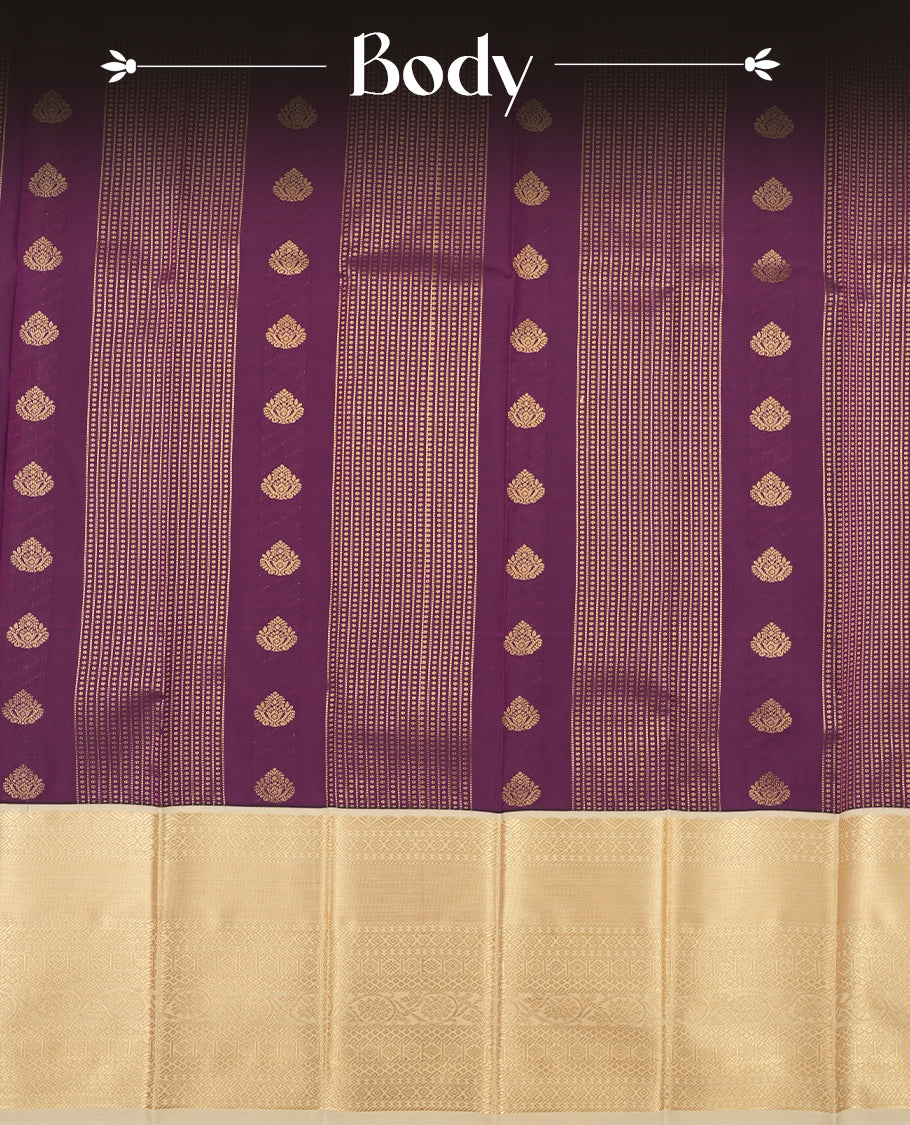 Grape purple colour Semi Silk Saree with gold zari striped patterns on the body, paired with a contrasting cream colour traditional pallu and border, and a matching blouse piece.