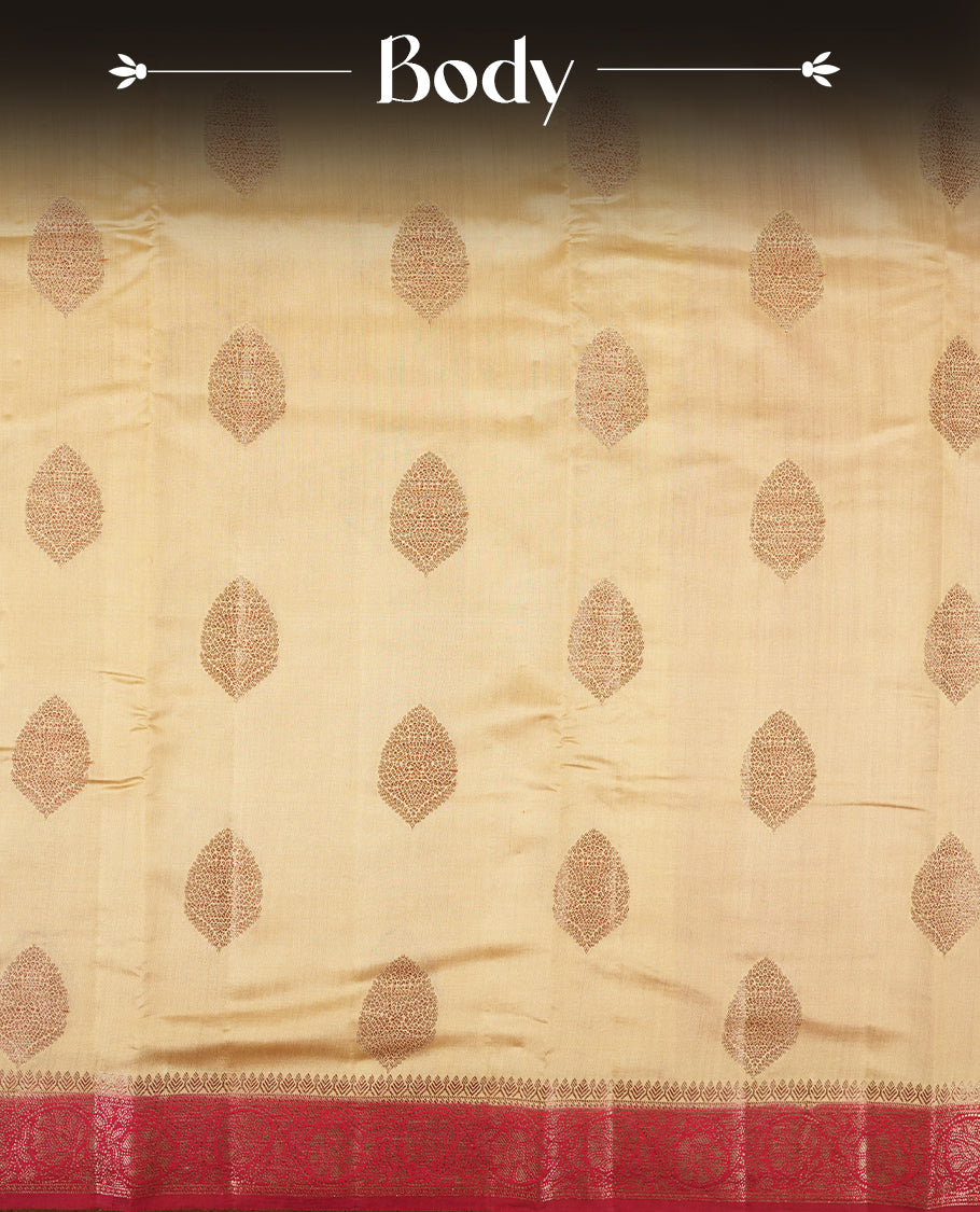 Cream Beige Colour Banaras Soft Silk Saree with Gold Zari Leaf Diamond Buttas, Intricate Multi-Layered Floral Border, Grand Pallu with Ornate Floral Brocade Motifs in Deep Red and Gold Tones, and Matching Red Blouse.