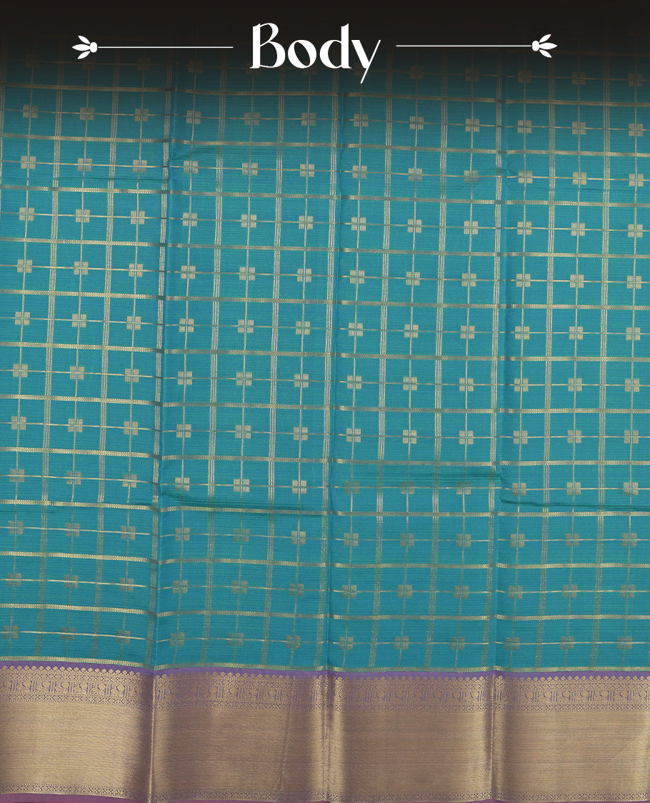 Aqua blue colour semi soft silk saree featuring a gold zari textured patterned body, complemented by contrast pink colour gold zari motifes on pallu & border and a matching blouse piece.