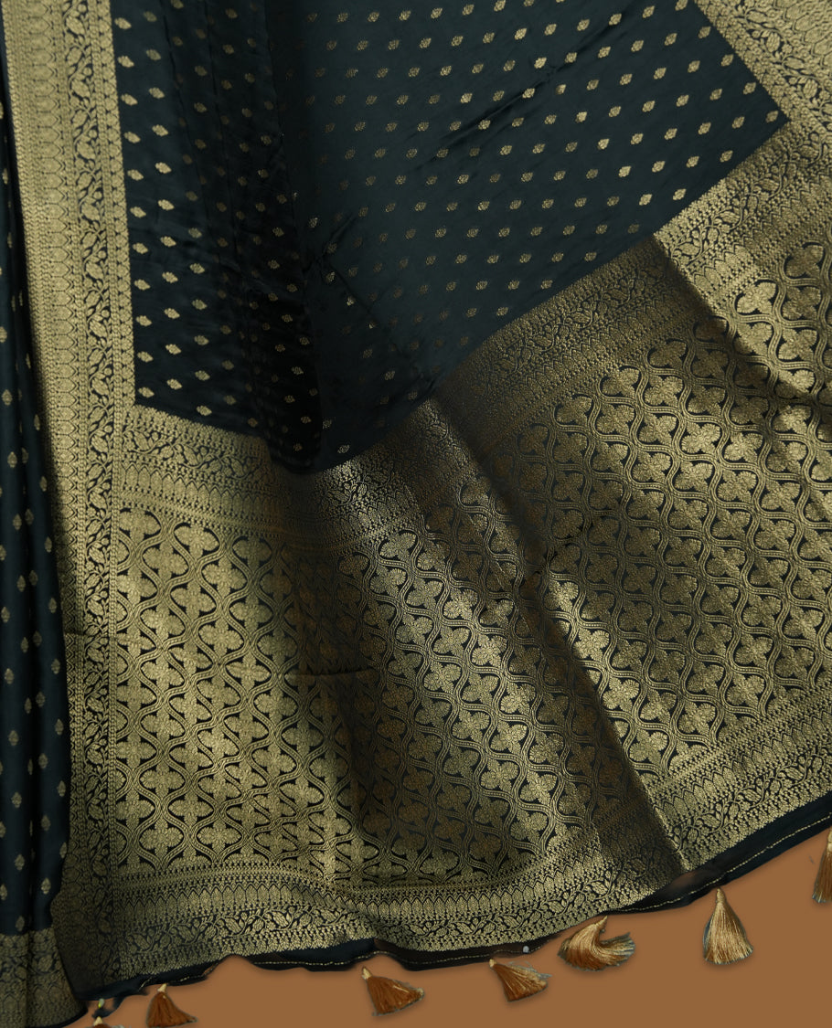 Deep Forest Green Colour Semi Banaras Satin Crepe Saree featuring Gold Zari Woven Small Buti Motifs, Intricately Designed Traditional Banarasi Border, Richly Woven Pallu with Ornate Patterns & Matching Blouse Piece