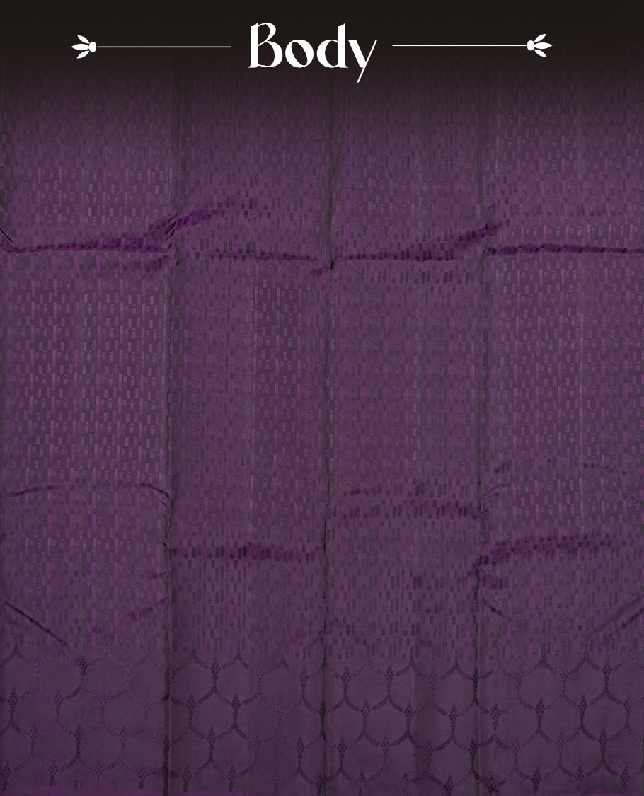 Deep violet colour semi soft silk saree featuring a self coloured textured patterned body, complemented by self coloured motifs on pallu & border and a matching blouse piece.